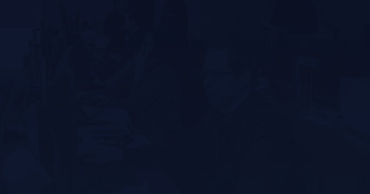 man in red jacket sitting beside woman in black and white long sleeve shirt